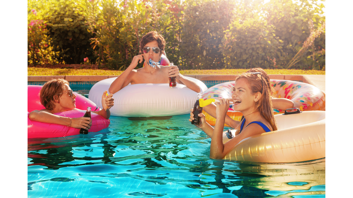 Friends sharing an afternoon together by the pool